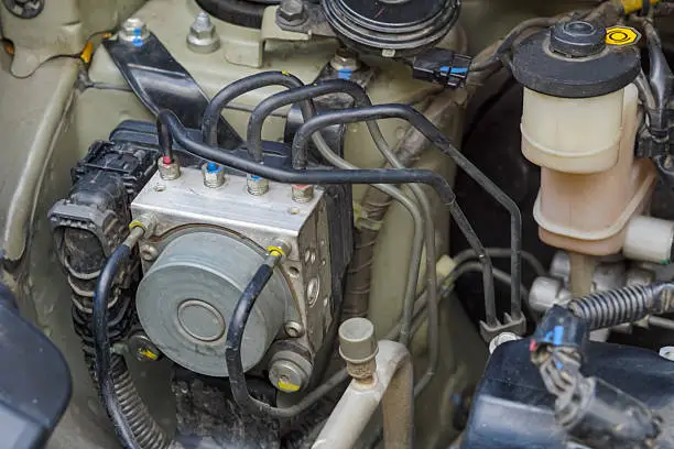 Failed ABS hydraulic control unit and pump assembly causing anti-lock braking system failure