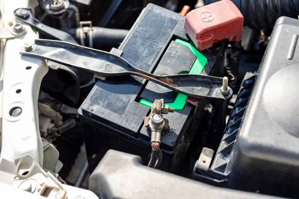 Weak or failing car battery causing starting problems and triggering the battery warning light