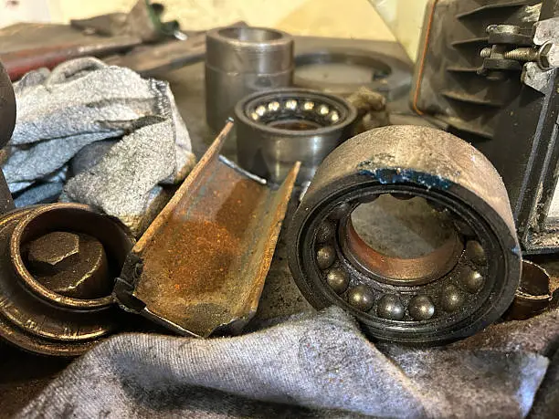Worn engine bearings showing excessive wear that can reduce oil pressure and cause severe engine damage.